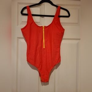 Tank swimsuit with zipper front and low back. Orange with yellow zipper size M
